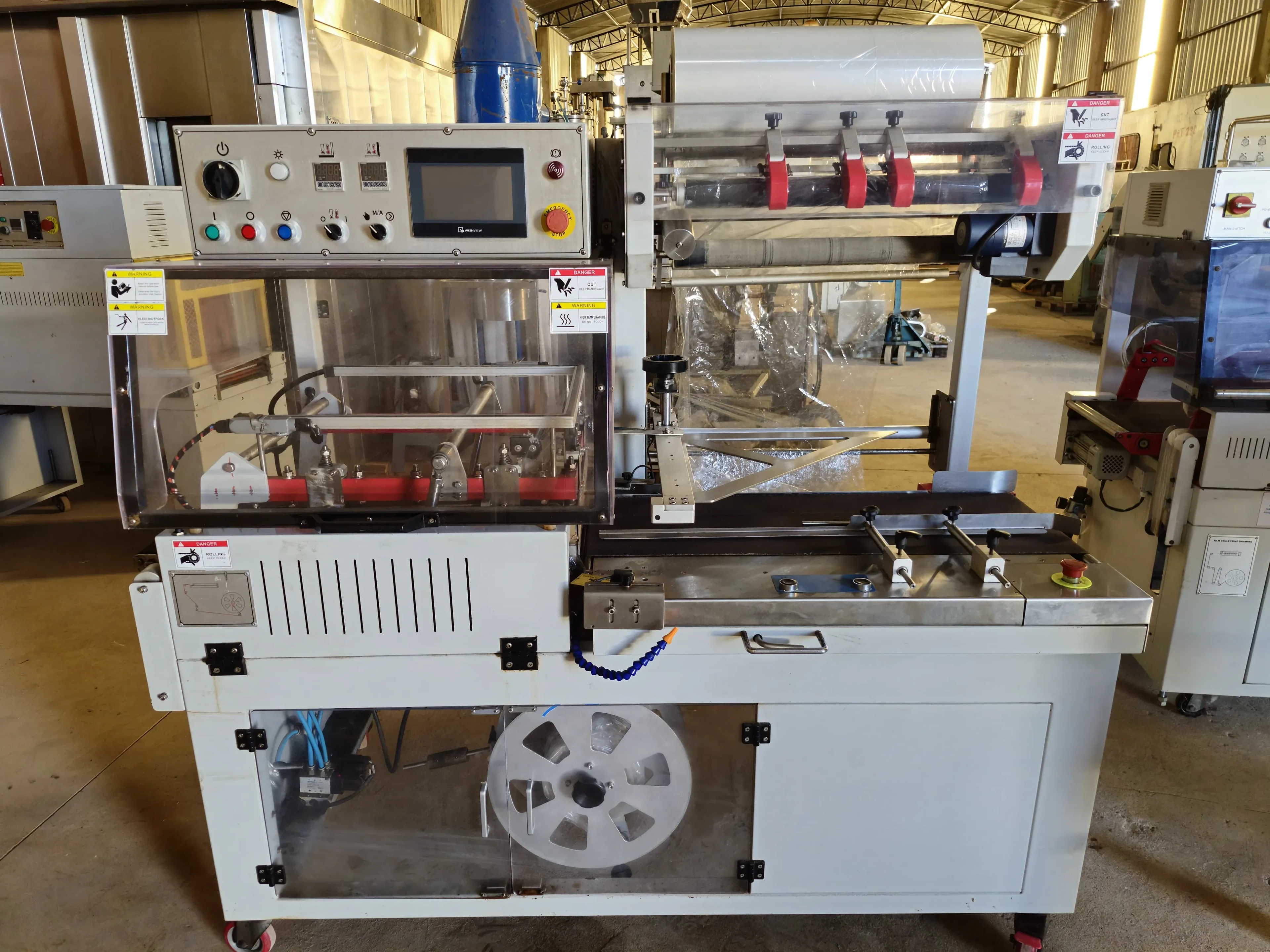 seladora-automatica-em-l-shrink-marca-tecfag