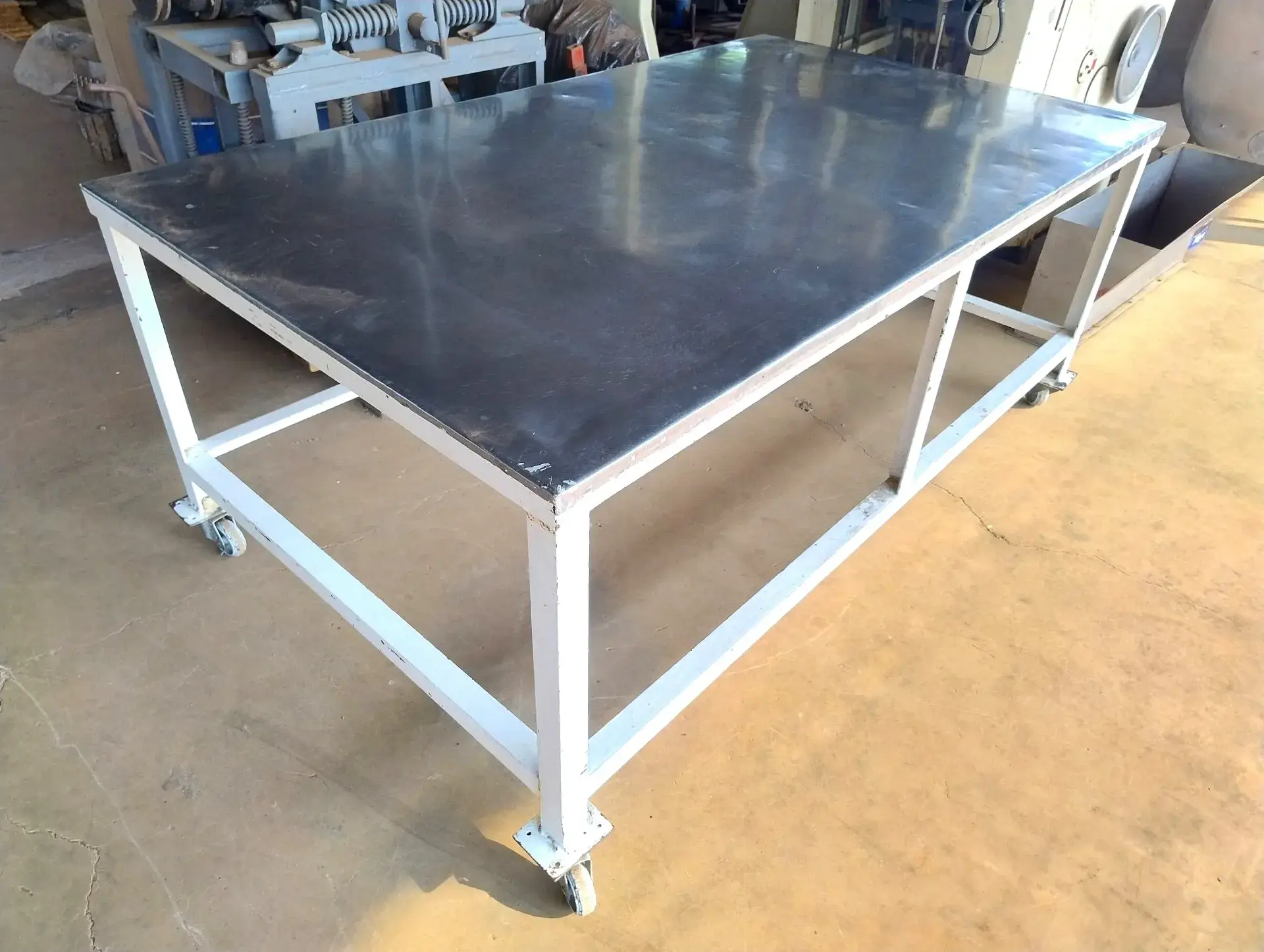 mesa-indust-aco-carbono-tampo-inox-dim-2-x-1.2-m-rodizios